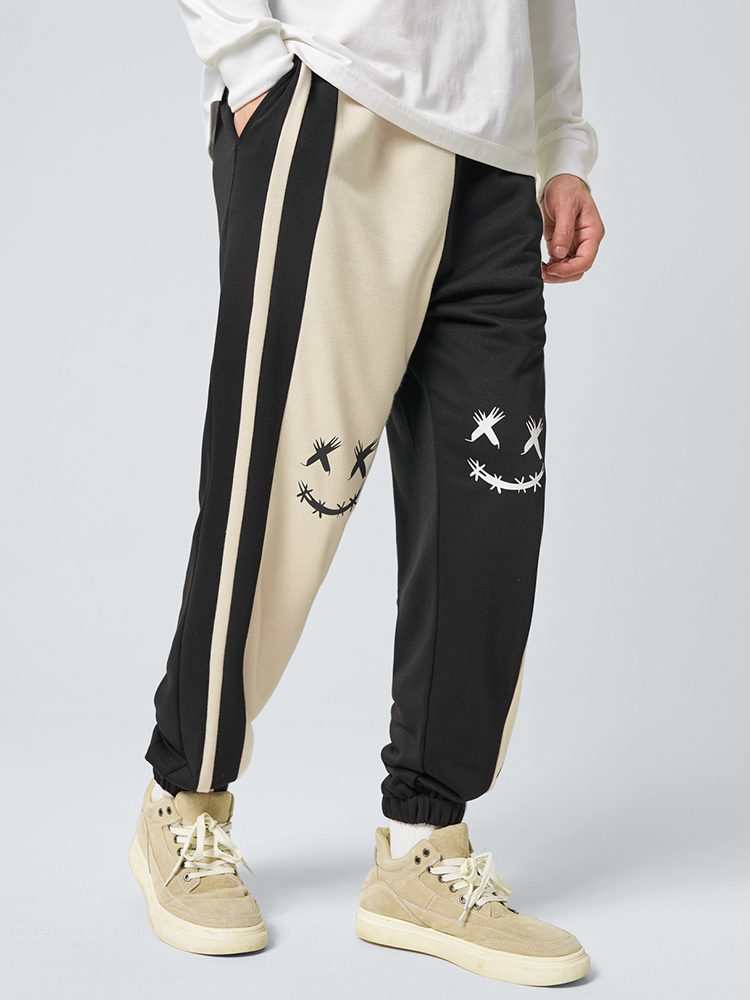ChArmkpR Mens Smile Face Print Contrast Patchwork Loose Cuffed Sweatpants